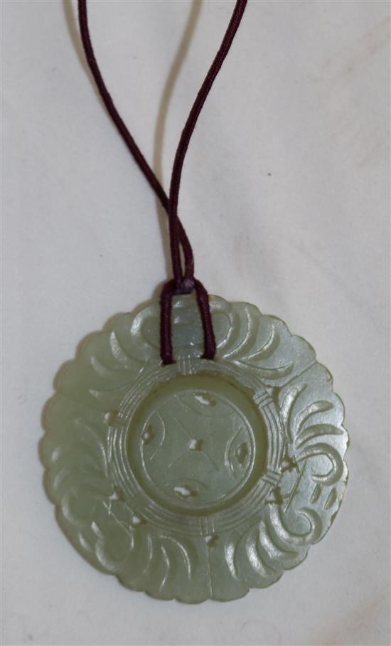 A group of five jadeite pendants and other hardstone carvings, 20th century, 2.4 to 7.7.cm (10)